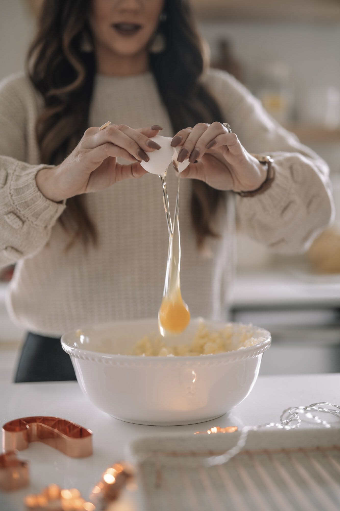 adding egg to bowl adding egg to bowl
