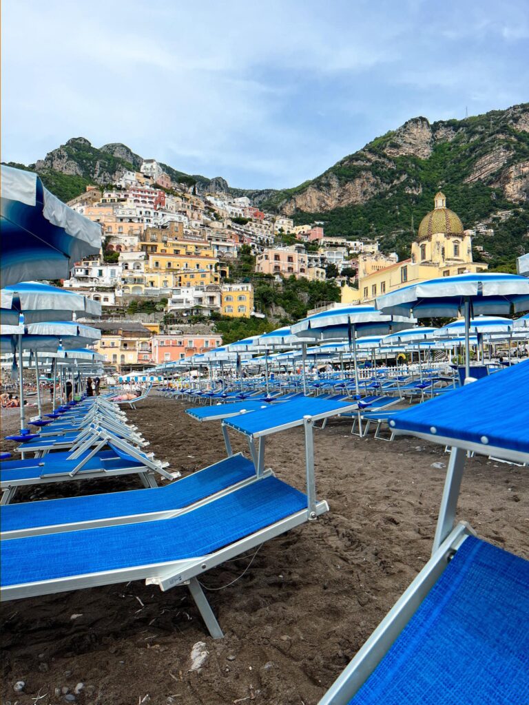 benches at a beach in Positano Italy