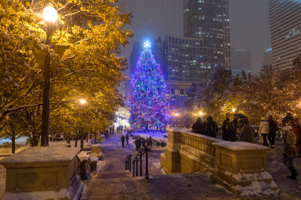 Holiday Vacation Destinations Giant Christmas tree at Christkindlmarket in Daley Plaza, Chicago, one of the top holiday vacation destinations.