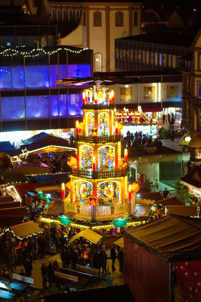 Holiday Vacation Destinations People enjoying Christkindlesmarkt in Nuremberg, Germany, one of the must-see holiday vacation destinations.