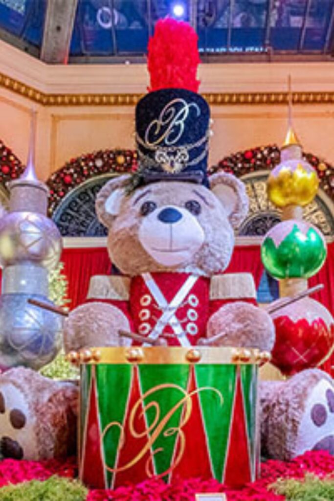 Giant teddy bear in Christmas display at Enchant Christmas Village – places to travel during Christmas.